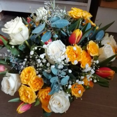 Tulip delight  - Handtied bouquet of spring tulips spray roses single roses gypsophila and greenery 